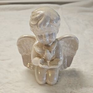 Iridescent Ceramic Kneeling Angel Holding A Bird Figurine